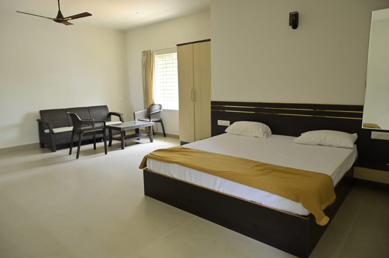 Air-Conditioned Master Bedroom at Malpe Manor